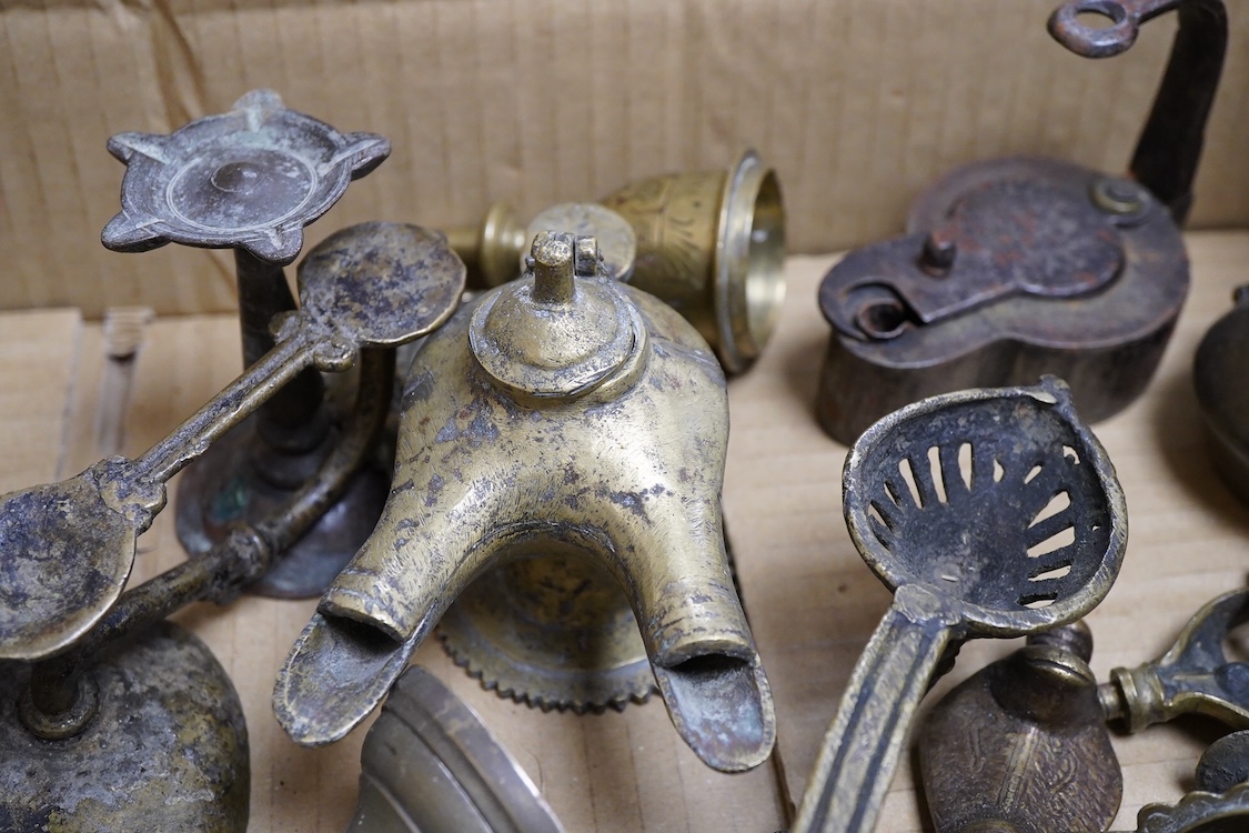 A group of small Middle Eastern mixed metalware lamps, burners etc